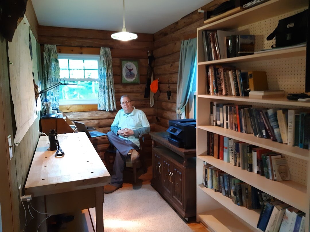 Croatian writer sitting at a wooden desk with a typewriter and notebook