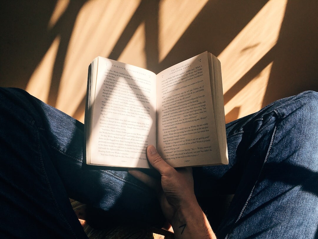 person reading mystery novel