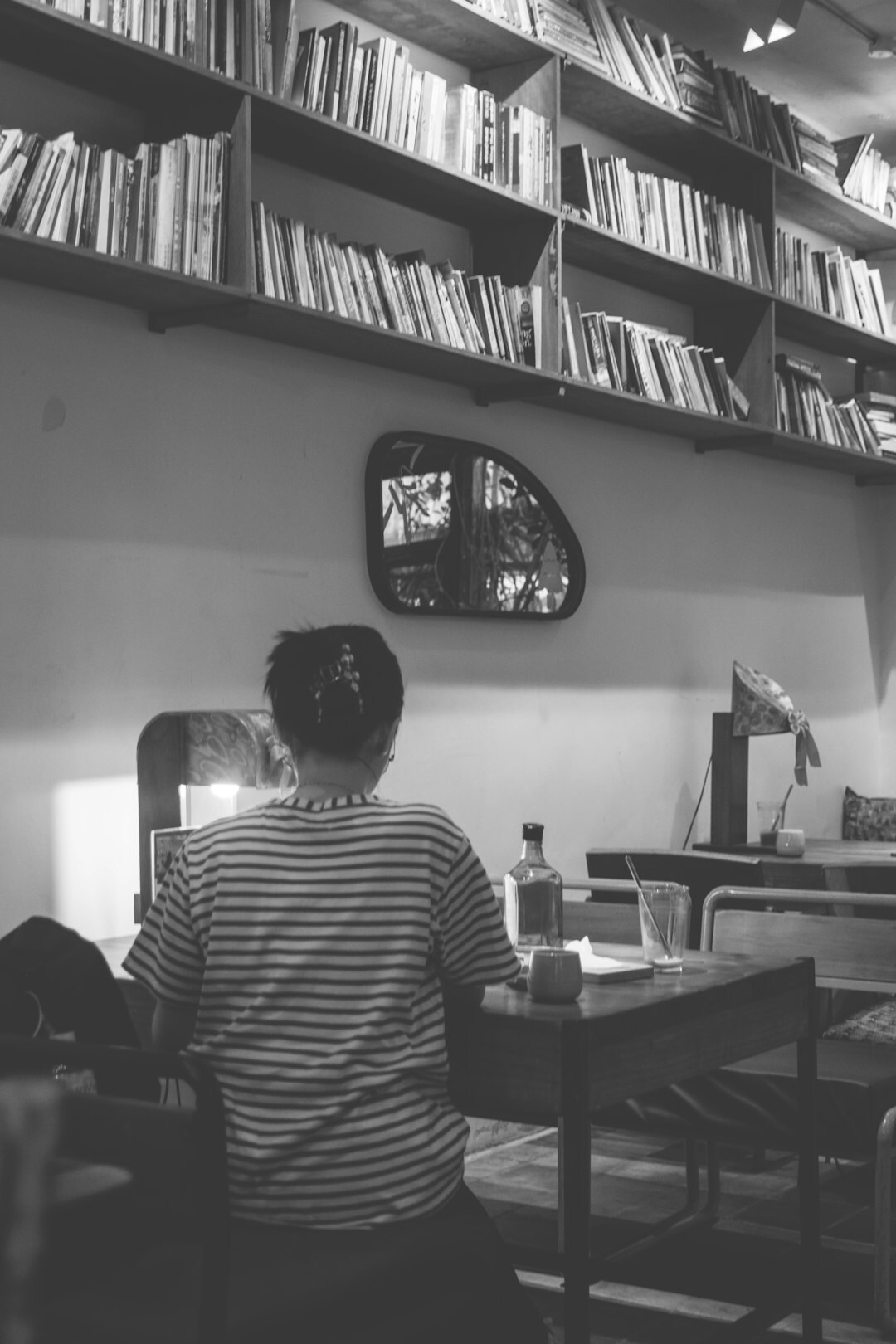 writer observing people in cafe